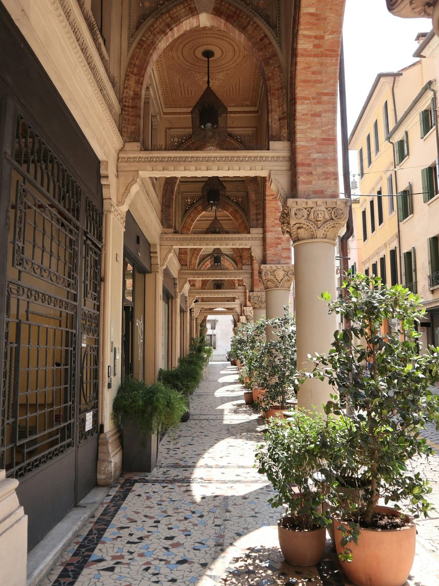 An arcade with mosaic paving in the centre of Treviso